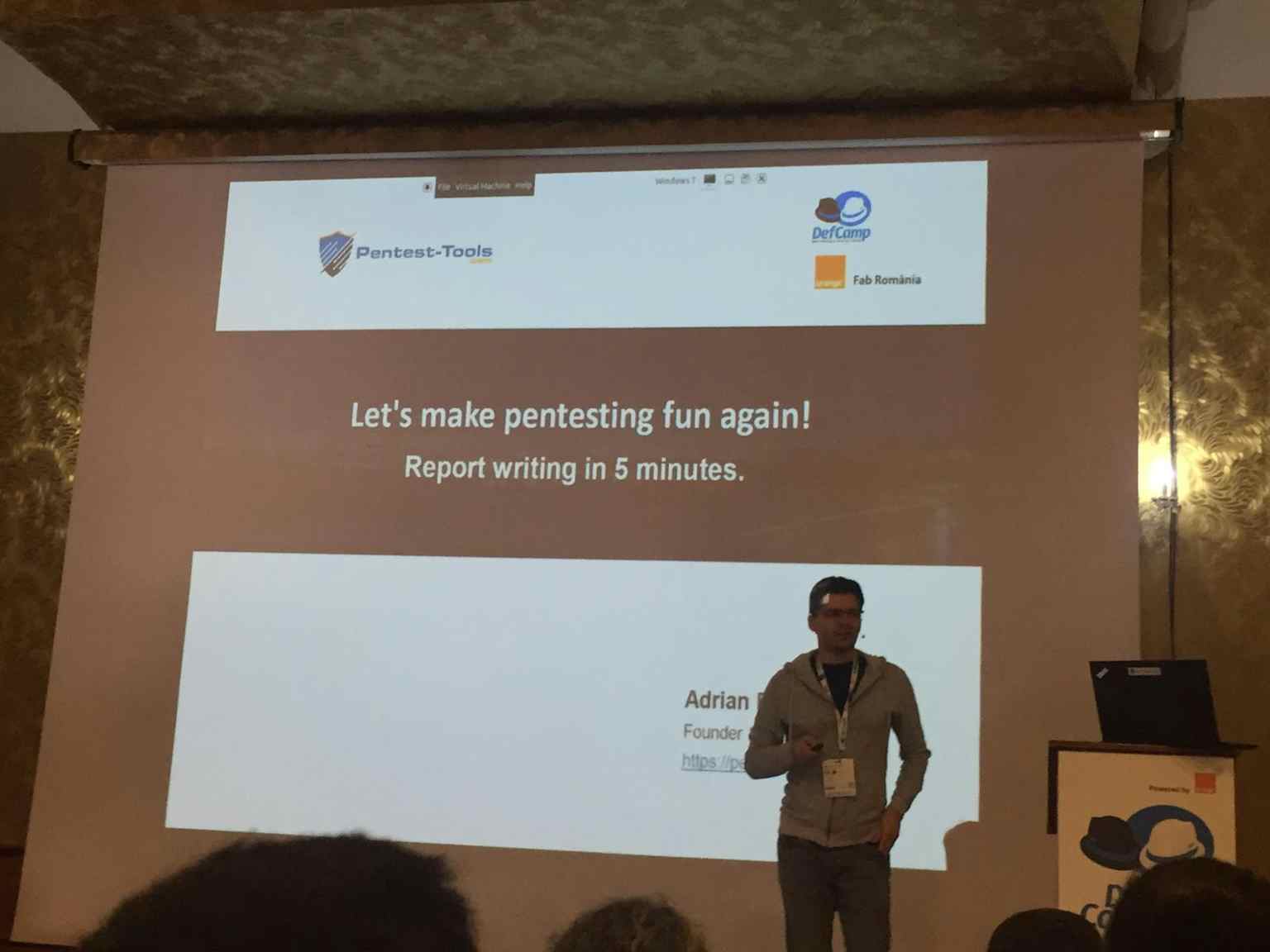 Adrian speaking at DefCamp conference about writing a pentest report faster